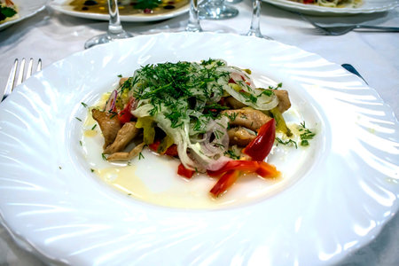 salad with herbs, fried mushrooms, onions, red pepperの写真素材