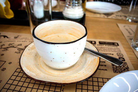 a mug and saucer on the table