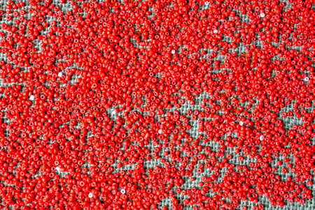 beads red on sacking, backgroundの写真素材
