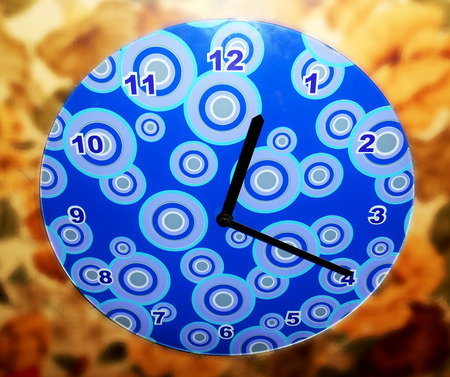 Wall clock on blurred background