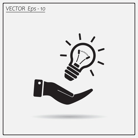 Electric light bulb in the palms, vector icon.のイラスト素材