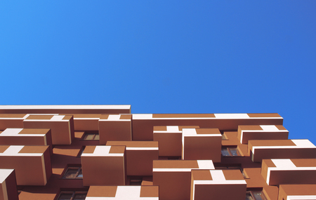 Modern office block with sunny beautiful sky.の写真素材
