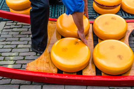 ALKMAAR, THE NETHERLANDS - APRIL 22, 2016: Typical cheese market at the Waagplein in the city of...