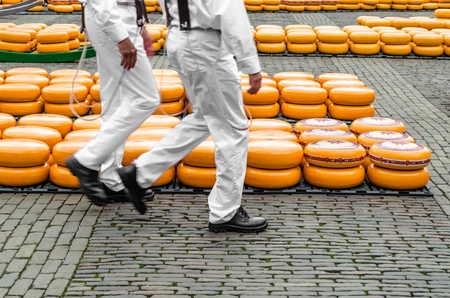 ALKMAAR, THE NETHERLANDS - APRIL 22, 2016: Typical cheese market at the Waagplein in the city of Alkmaar (the Netherlands), one of the only four traditional Dutch cheese markets still in existence and one of the country's most popular tourist attractions.のeditorial素材