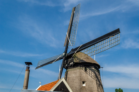 ALKMAAR, THE NETHERLANDS - AUGUST 25, 2013: Traditional Dutch windmills along the quay in Oudorp, Alkmaar (the Netherlands), built between 1627-1630.のeditorial素材