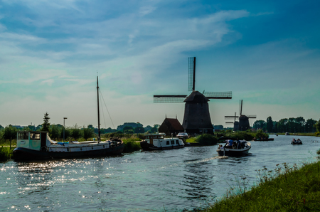 ALKMAAR, THE NETHERLANDS - AUGUST 25, 2013: Traditional Dutch windmills along the quay in Oudorp, Alkmaar (the Netherlands), built between 1627-1630.のeditorial素材