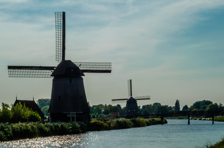 ALKMAAR, THE NETHERLANDS - AUGUST 25, 2013: Traditional Dutch windmills along the quay in Oudorp, Alkmaar (the Netherlands), built between 1627-1630.のeditorial素材