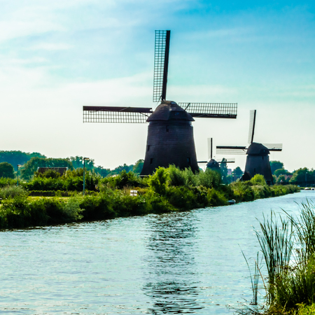 ALKMAAR, THE NETHERLANDS - AUGUST 25, 2013: Traditional Dutch windmills along the quay in Oudorp, Alkmaar (the Netherlands), built between 1627-1630.のeditorial素材