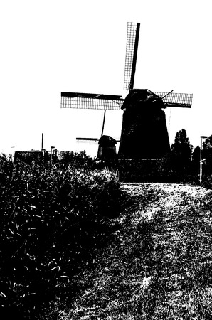 ALKMAAR, THE NETHERLANDS - AUGUST 25, 2013: Black and white silhouette of a traditional Dutch windmills along the quay in Oudorp, Alkmaar (the Netherlands), built between 1627-1630.のeditorial素材