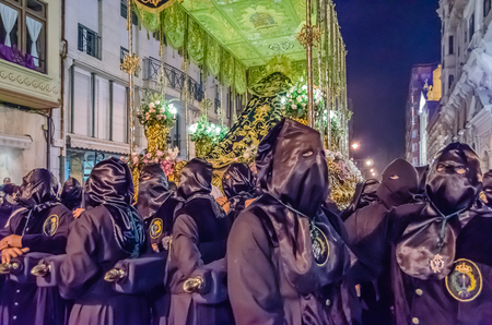 PALENCIA, SPAIN - MARCH 24, 2016: Traditional Spanish Holy Week (Semana Santa) procession on Holy Thursday night in the streets of Palencia (Castilla y Leon), Spainのeditorial素材