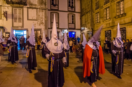 SANTIAGO DE COMPOSTELA, SPAIN - APRIL 3, 2015: Traditional Spanish Holy Week (Semana Santa) procession on Holy Thursday night in the streets of Santiago de Compostela (Galicia), Spainのeditorial素材