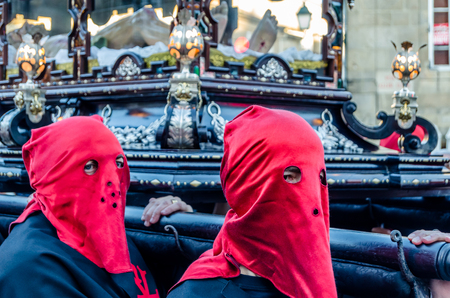 SANTIAGO DE COMPOSTELA, SPAIN - APRIL 3, 2015: Traditional Spanish Holy Week (Semana Santa) procession on Holy Friday in the streets of Santiago de Compostela (Galicia), Spainのeditorial素材