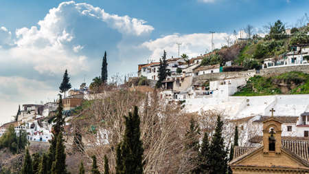 GRANADA, SPAIN - FEBRUARY 20, 2015: Traditional houses in the picturesque neighborhood of Sacromonte in Granada, Andalusia, southern Spainのeditorial素材