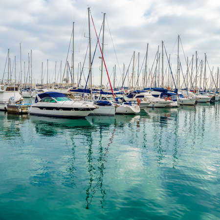 ALICANTE, SPAIN - DECEMBER 27, 2018: View of sailboats and yachts in the Mediterranean port of...