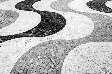 Black and white image of cobblestone pavement in Alicante, Spain, textured backgroundの写真素材
