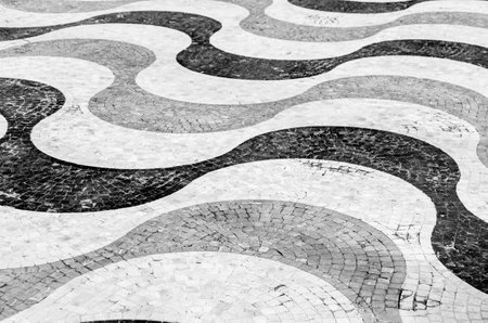 Black and white image of cobblestone pavement in Alicante, Spain, textured backgroundの写真素材
