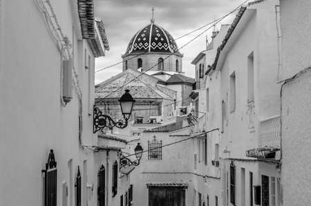 Beautiful Church of Our Lady of Consolation in the Mediterranean village of Altea, Alicante province, Spain; black and white imageの写真素材