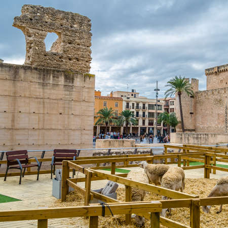 ELCHE, SPAIN - DECEMBER 29, 2018: Living Nativity scene in the town of Elche, Alicante province, Spain, a Christian tradition during the Christmas season, displayed near the castle and the town museum.のeditorial素材