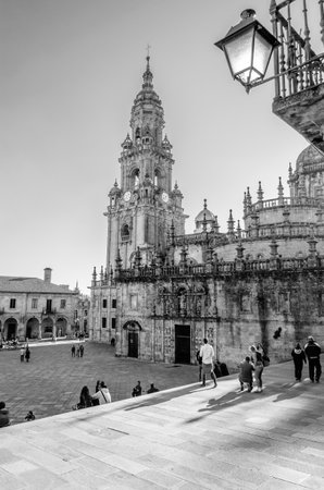 SANTIAGO DE COMPOSTELA, SPAIN - APRIL 4, 2015: Pilgrims of St James Way and tourists in the cathedral square  in Santiago de Compostela, Galicia, northern Spainのeditorial素材