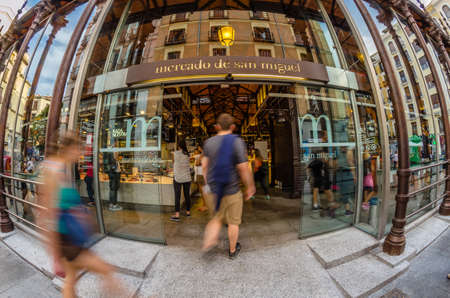 MADRID, SPAIN - AUGUST 27, 2017: A fisheye outside view of the "Mercado de San Miguel" (Market of San Miguel), popular among tourists, not a traditional grocery market but a gourmet tapas market, located in the center of Madrid, declared Spanish Property のeditorial素材