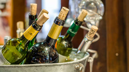 MADRID, SPAIN - AUGUST 27, 2017: Ice bucket with several bottles of wine served in a bar in Madrid, Spainのeditorial素材