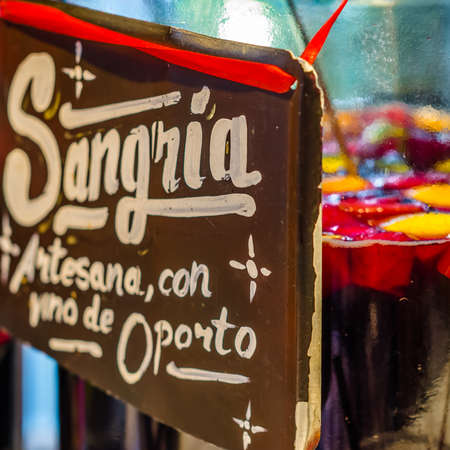 MADRID, SPAIN - AUGUST 27, 2017:  Artisan port wine sangria served at a market stand inside the historical "Mercado de San Miguel" (Market of San Miguel), popular among tourists, located in the center of Madrid, Spainのeditorial素材