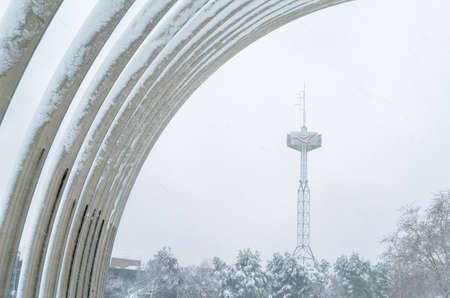 MADRID, SPAIN â JANUARY 9, 2021: View of the urban sculpture designed by Andreu Alfaro, called âPuerta de la Ilustracionâ, during Storm âFilomenaâ, the heaviest snowfall in 50 years in Madrid, Spainのeditorial素材