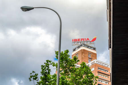 MADRID, SPAIN â€“ MAY 12, 2021: Iberia airlines logo on the top of a building in Madrid, Spain