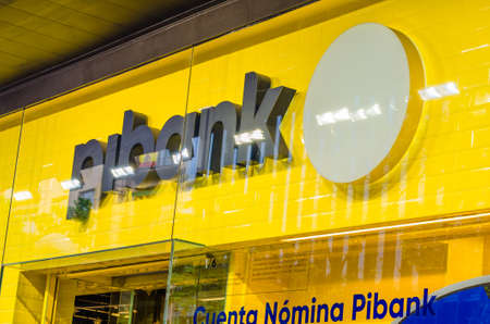 MADRID, SPAIN â MAY 12, 2021: Pibank logo on a bank branch office in Madrid, Spain. Pibank is a digital bank, it belongs to the Pichincha banking groupのeditorial素材