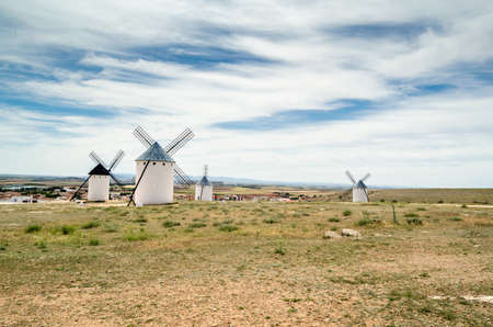 CAMPO DE CRIPTANA, SPAIN - MAY 22, 2021: Tourists visiting the typical windmills in Campo de Criptana, Spain, on the famous Don Quixote Routeのeditorial素材