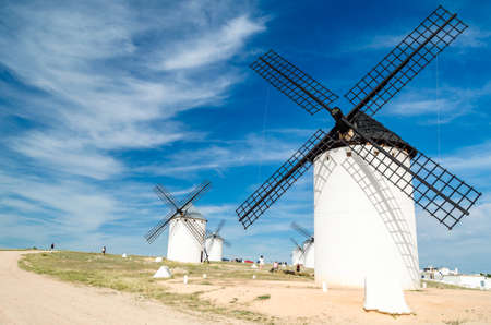 CAMPO DE CRIPTANA, SPAIN - MAY 22, 2021: Tourists visiting the typical windmills in Campo de Criptana, Spain, on the famous Don Quixote Routeのeditorial素材