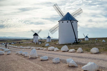 CAMPO DE CRIPTANA, SPAIN - MAY 22, 2021: Tourists visiting the typical windmills in Campo de Criptana, Spain, on the famous Don Quixote Routeのeditorial素材
