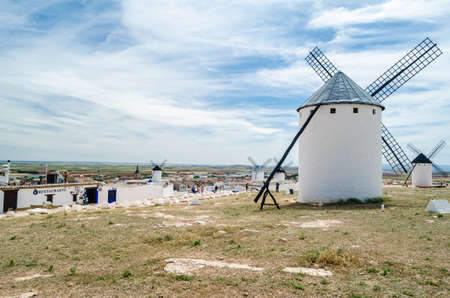 CAMPO DE CRIPTANA, SPAIN - MAY 22, 2021: Tourists visiting the typical windmills in Campo de Criptana, Spain, on the famous Don Quixote Routeのeditorial素材