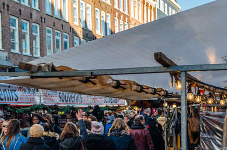 AMSTERDAM, THE NETHERLANDS - NOVEMBER 17, 2018: People visiting the Albert Cuyp Market, a street...