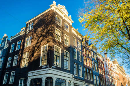 AMSTERDAM, THE NETHERLANDS - NOVEMBER 17, 2018: Urban landscape, typical Dutch architecture in Amsterdam, the Netherlandsのeditorial素材