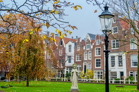 AMSTERDAM, THE NETHERLANDS - NOVEMBER 16, 2018: Architecture in Begijnhof (the Beguinage), an inner court in Amsterdam which was founded during the Middle Ages, it is a group of historic buildings, mostly private dwellings.のeditorial素材