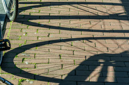 Shadow of a bicycle in Amsterdam, the Netherlandsの写真素材