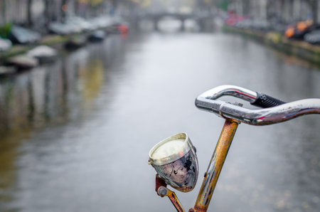 Closeup of a bicycle handle bar in Amsterdam, the Netherlandsの写真素材