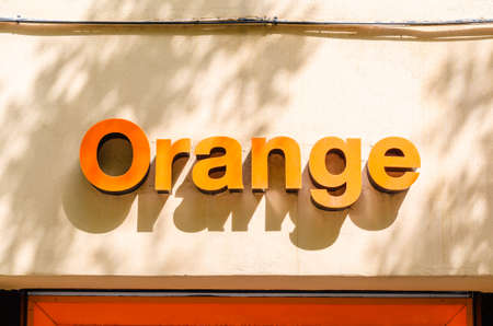 MADRID, SPAIN - JULY 23, 2021: Facade of an Orange store in Madrid, Spain, a well-known...