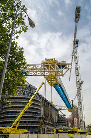 MADRID, SPAIN - SEPTEMBER 13, 2021: Cranes in the renovation works of the Santiago BernabÃ©u Stadium, home of Real Madridのeditorial素材