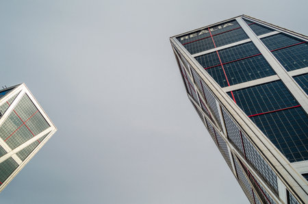 MADRID, SPAIN - SEPTEMBER 13, 2021: One of the inclined buildings of The Gate of Europe towers (KIO Towers), twin office buildings in Plaza de Castilla, Madrid, Spain; designed by the American architects Philip Johnson and John Burgee, constructed betweenのeditorial素材