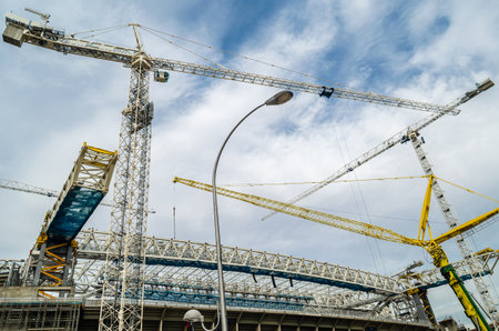 MADRID, SPAIN - SEPTEMBER 13, 2021: Cranes in the renovation works of the Santiago BernabÃ©u Stadium, home of Real Madridのeditorial素材