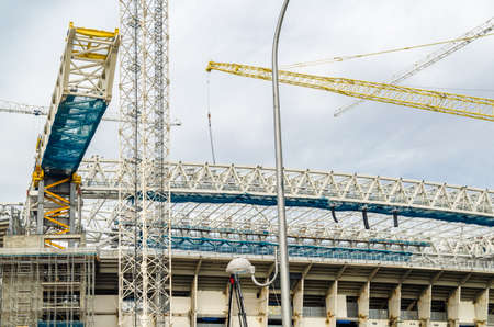 MADRID, SPAIN - SEPTEMBER 13, 2021: Cranes in the renovation works of the Santiago BernabÃ©u Stadium, home of Real Madridのeditorial素材