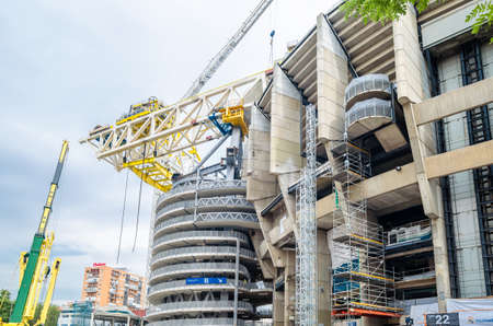 MADRID, SPAIN - SEPTEMBER 13, 2021: Cranes in the renovation works of the Santiago BernabÃ©u...