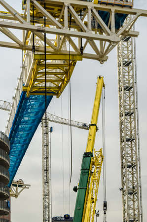MADRID, SPAIN - SEPTEMBER 13, 2021: Cranes in the renovation works of the Santiago BernabÃ©u...