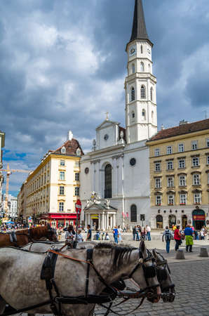 VIENNA, AUSTRIA - SEPTEMBER 1, 2013: Famous Lipizzaner horses and carriage on the street in Vienna, Austriaのeditorial素材