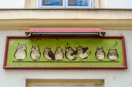 VIENNA, AUSTRIA - SEPTEMBER 1, 2013: Architectural detail, shop facade with owls logo in Vienna, Austriaのeditorial素材