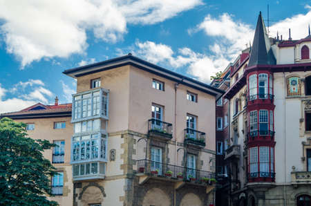 PORTUGALETE, SPAIN - JULY 7, 2021: Architectural detail, colorful facades in the old town of  Portugalete, Basque Country, Spainのeditorial素材