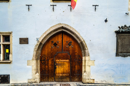 CLUJ-NAPOCA, ROMANIA - NOVEMBER 14, 2013: Facade of the Gothic Matthias Corvinus House, one of the oldest buildings in Cluj-Napoca, Transylvania, Romania, built in the 15th century, now owned by the Art and Design University of Cluj-Napocaのeditorial素材