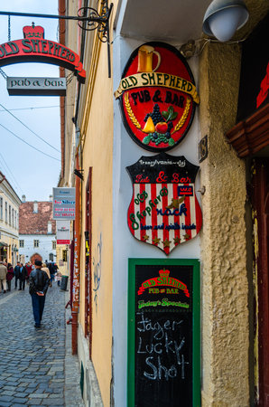 CLUJ-NAPOCA, ROMANIA - NOVEMBER 14, 2013: Entrance to an Irish pub in the old town of Cluj-Napoca, Transylvania, Romaniaのeditorial素材